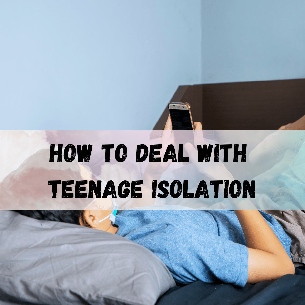 Teen lying on a bed, looking at a smartphone, which may indicate feelings of isolation as discussed by Key Healthcare